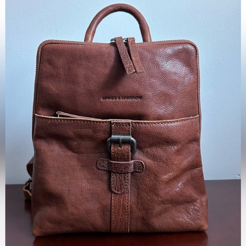 Spikes and Sparrow Distressed Bronco Leather Buckle Mini Backpack.
